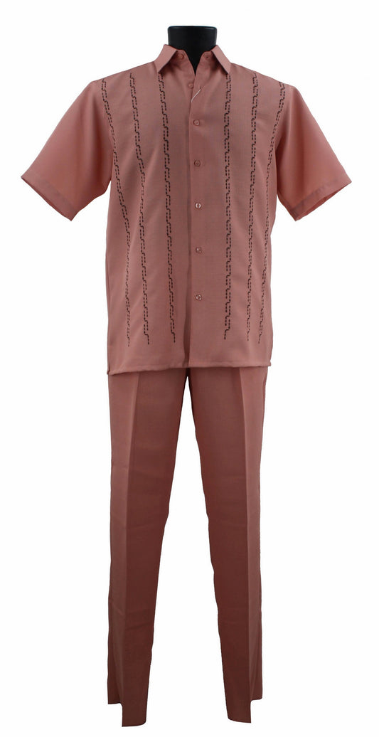 A mannequin showcased the Bassiri Peach 2pc Set A 139, featuring a chic pink short-sleeve button-up shirt adorned with black embroidery and coordinating pink pants, all made from comfortable polyester fabric.