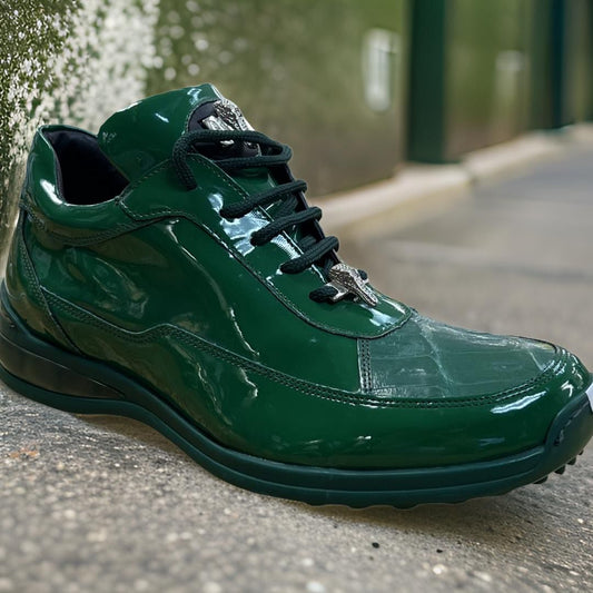 Close-up of a shiny dark green Mauri 8900 sneaker with black laces and a silver emblem, resembling sleek patent leather, placed on a textured outdoor surface.