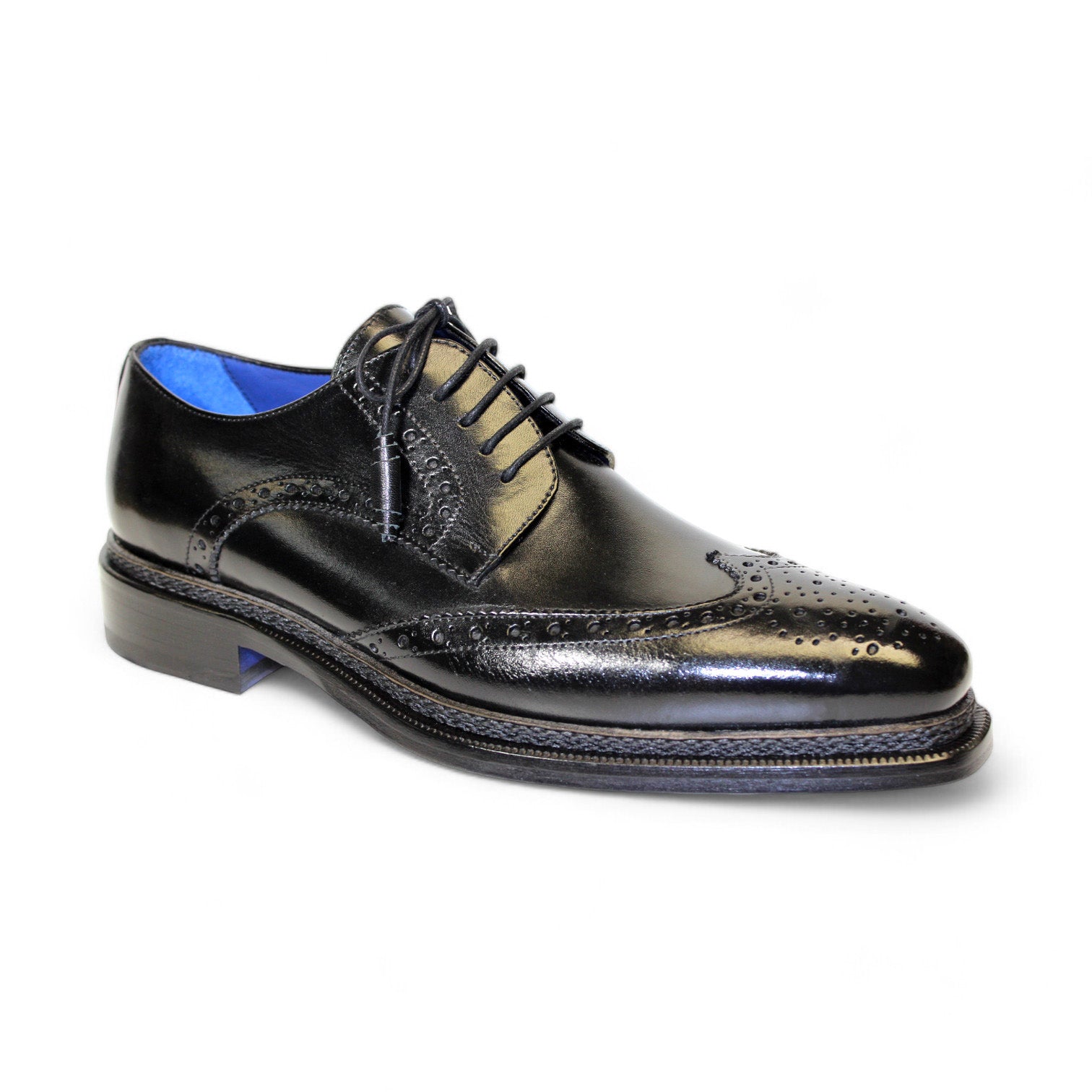 The Emilio Franco Artigiana "Adriano" black shoe, crafted in Italy, showcases decorative perforations, a blue inner lining, and black laces, elegantly displayed on a white background.