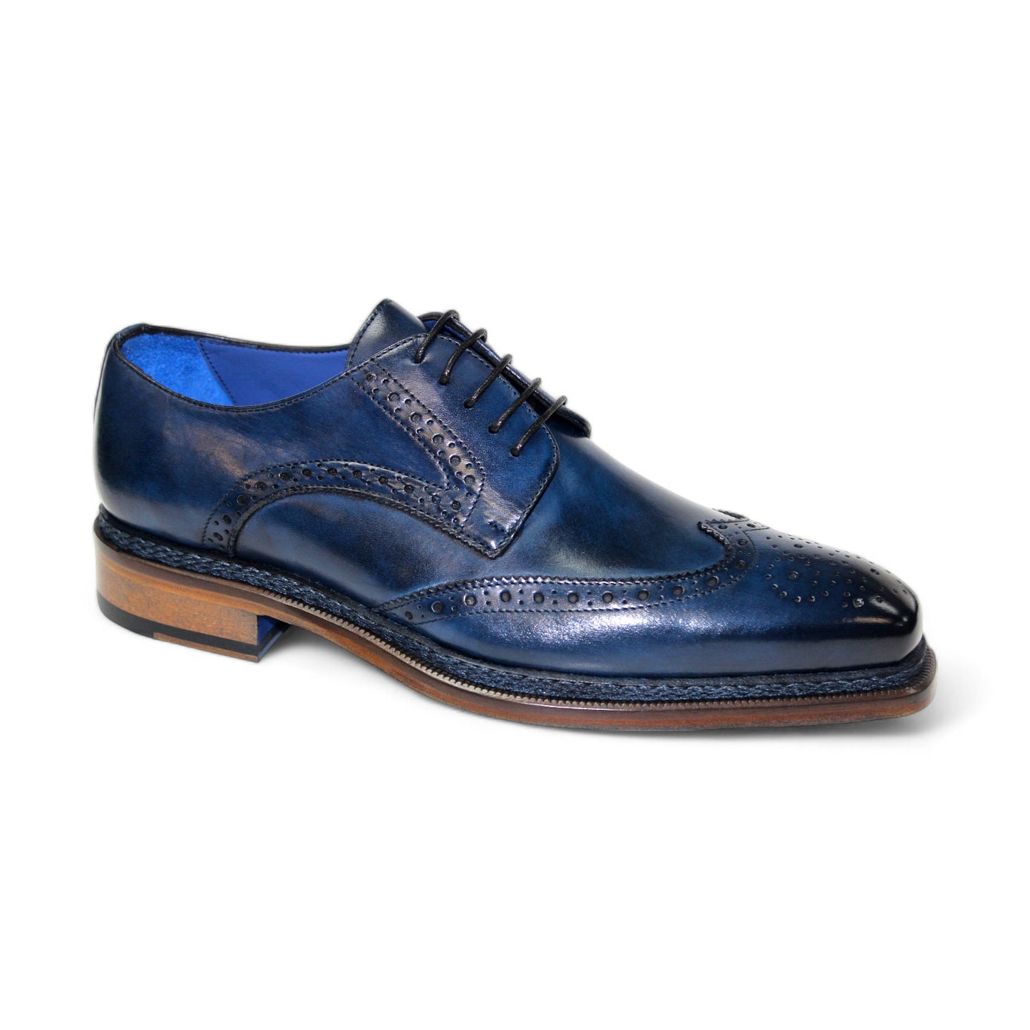 The Emilio Franco "Adriano" Navy Shoes, crafted by Emilio Franco Artigiana, feature dark blue leather with decorative perforations, a light brown sole, and a blue interior lining. Expertly made in Italy, these shoes effortlessly blend timeless style with exceptional craftsmanship.