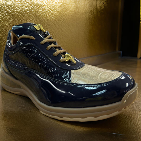 A pair of multicolored, glossy sneakers made from blue and tan patent leather features a thick sole and is showcased against a textured gold background, emphasizing the luxurious design of the Mauri 8000 custom-made shoes.