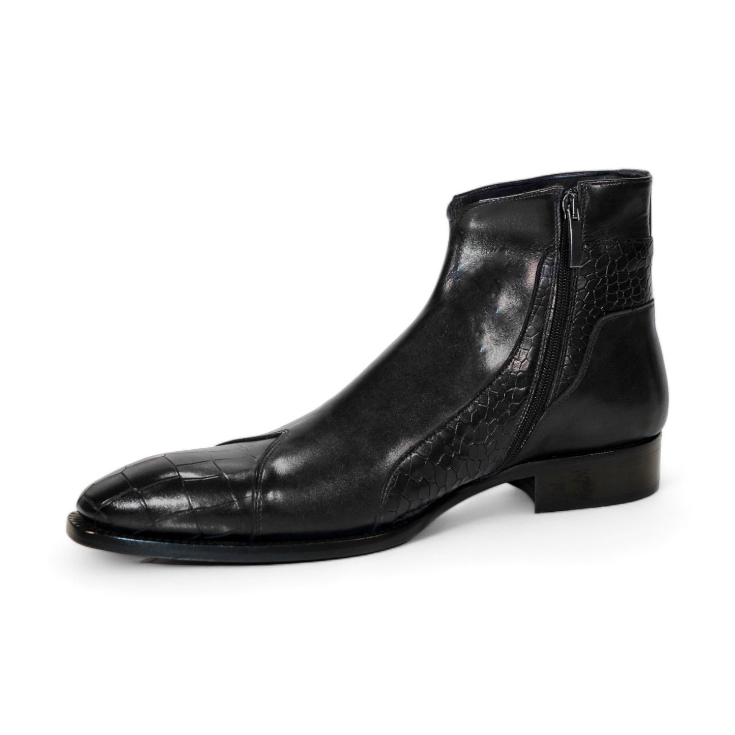 The Duca Di Matiste Aprilia (Black) ankle boot is skillfully crafted from genuine leather, showcasing a distinctive embossed Croco design on the toe and side. With its sleek finish and low heel, this Italian-made footwear embodies elegance.