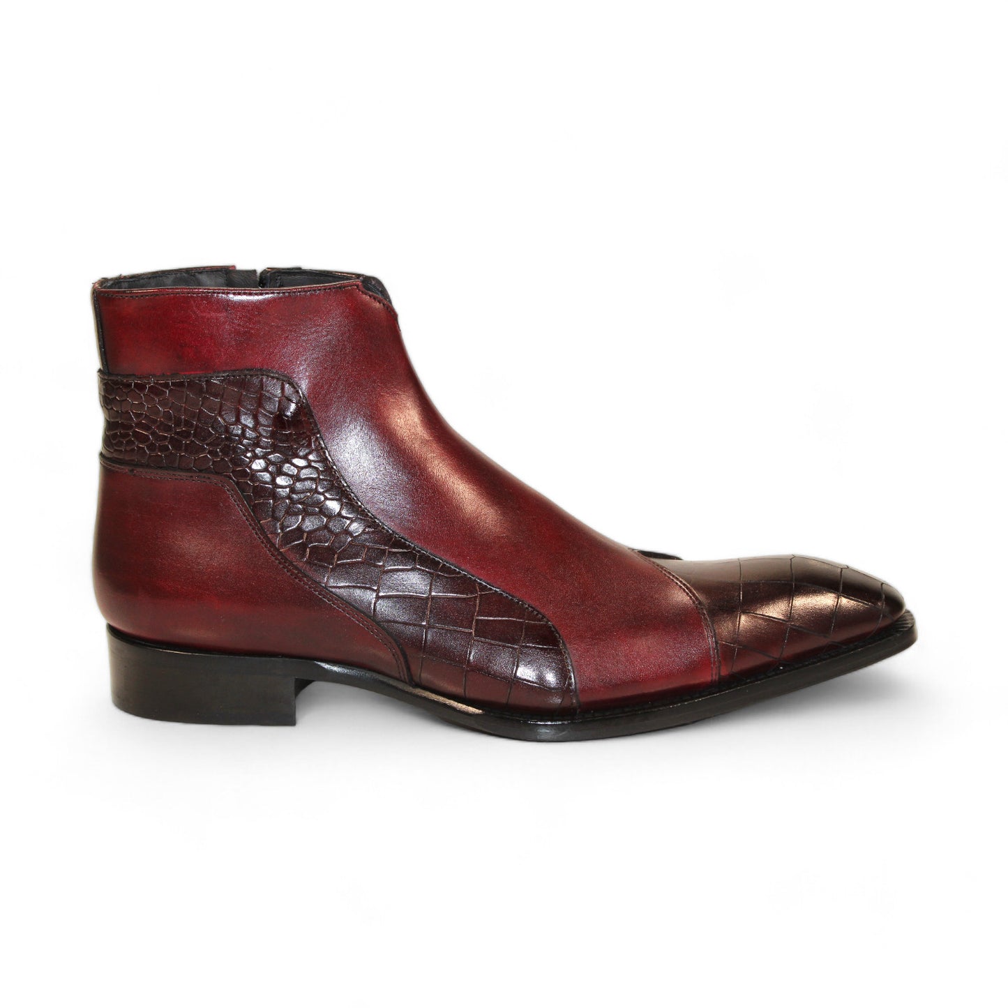 Displayed strikingly against a white background, the Duca Di Matiste Aprilia ankle boot in Burgundy/Antique Red features a luxurious Italian leather design with embossed croco pattern accents and a tasteful low heel.