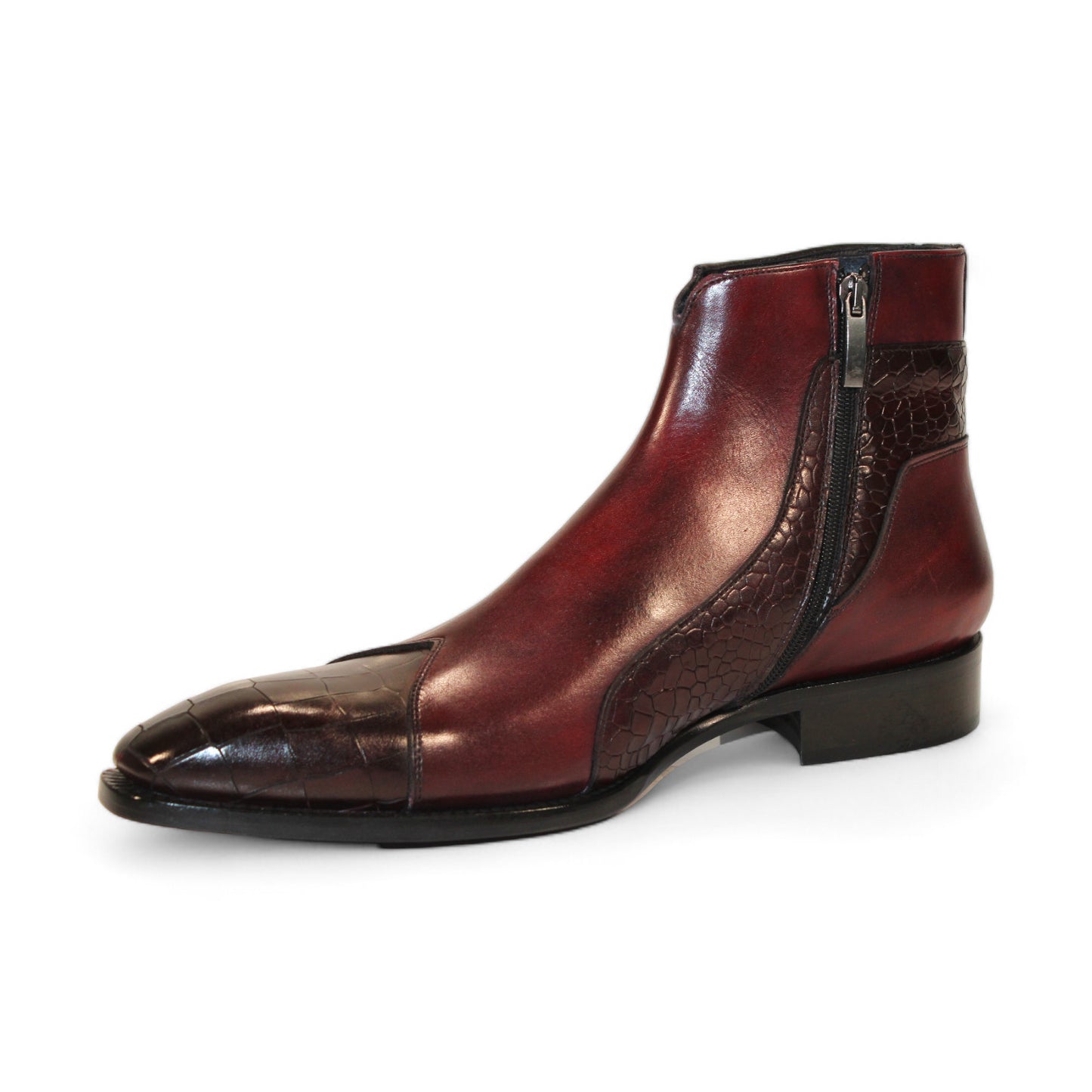 Displayed strikingly against a white background, the Duca Di Matiste Aprilia ankle boot in Burgundy/Antique Red features a luxurious Italian leather design with embossed croco pattern accents and a tasteful low heel.