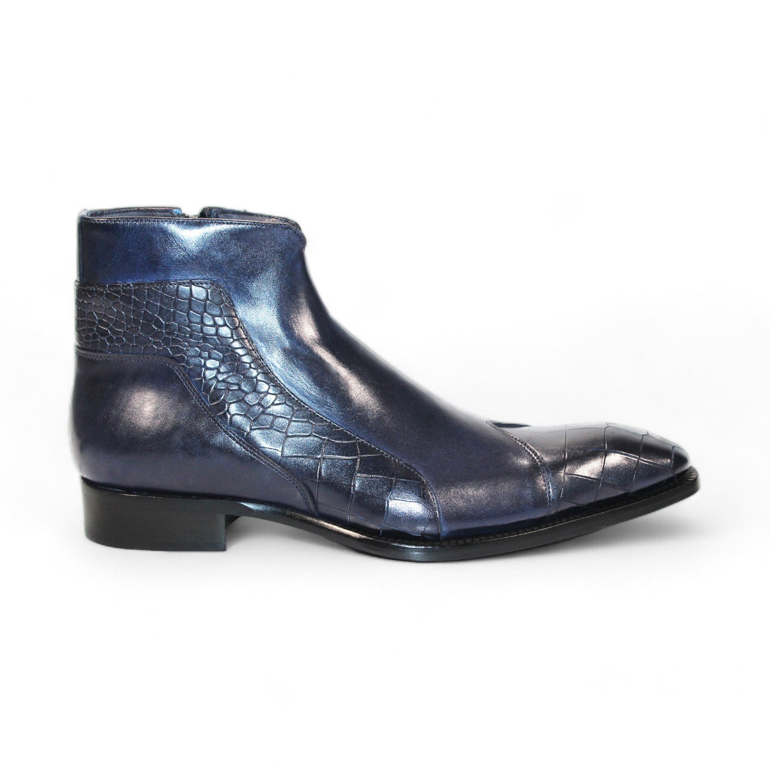 The Duca Di Matiste Aprilia (Navy), made in Italy, is a blue leather ankle boot featuring a striking crocodile pattern and square toe on a pristine white background.