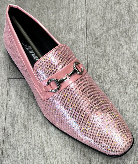 The Exclusive Formal Dress Shoe Pink SUTTON by UNIQUE DESIGN MENSWEAR, featuring a genuine leather pink glittery loafer with a metal bit detail on the vamp, is elegantly displayed on a gray floor.