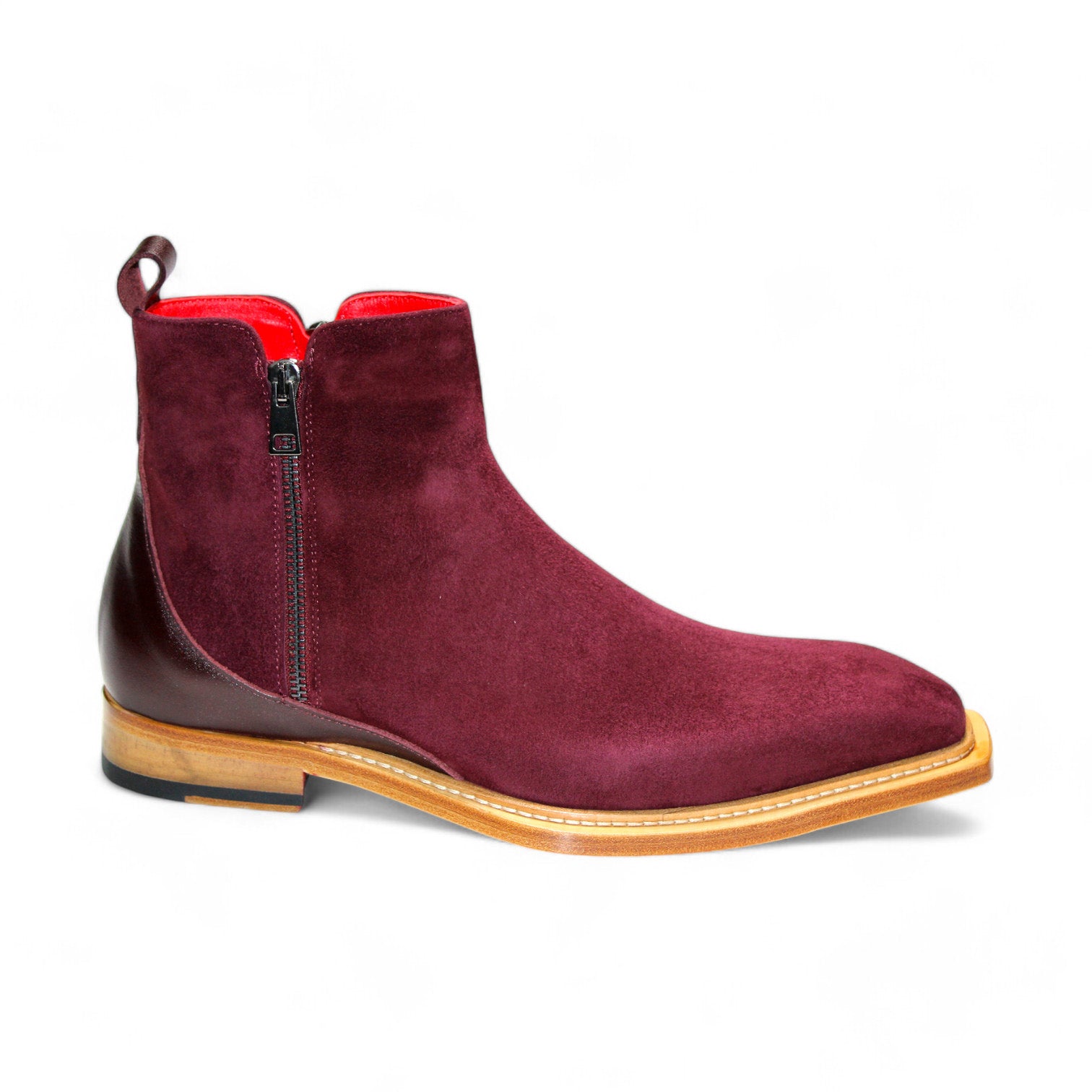 The Emilio Franco "Cesare" Burgundy Boot is an expertly crafted Italian ankle boot featuring a burgundy suede exterior, side zipper, wooden sole, and red interior lining.