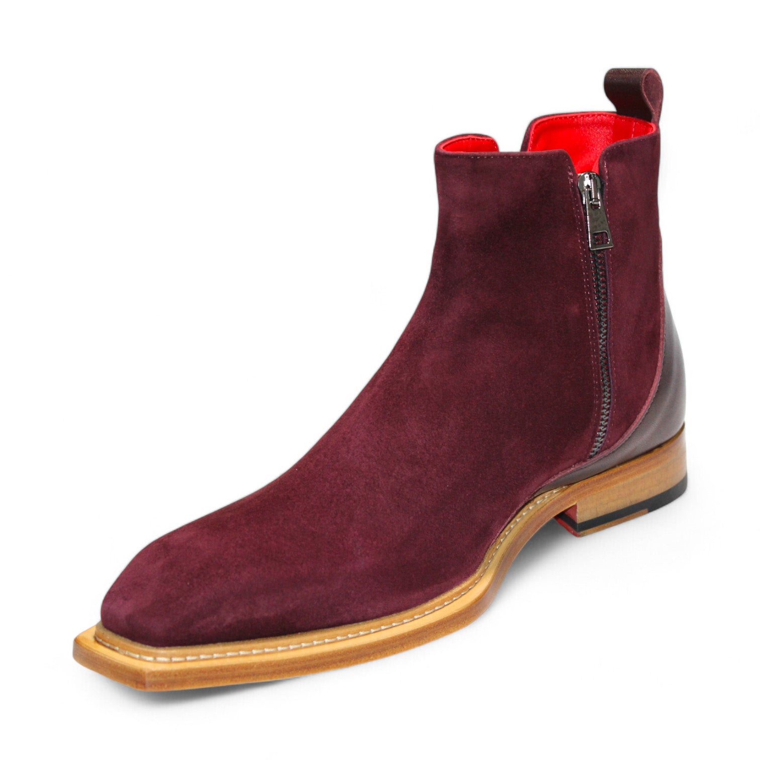 The Emilio Franco "Cesare" Burgundy Boot is an expertly crafted Italian ankle boot featuring a burgundy suede exterior, side zipper, wooden sole, and red interior lining.