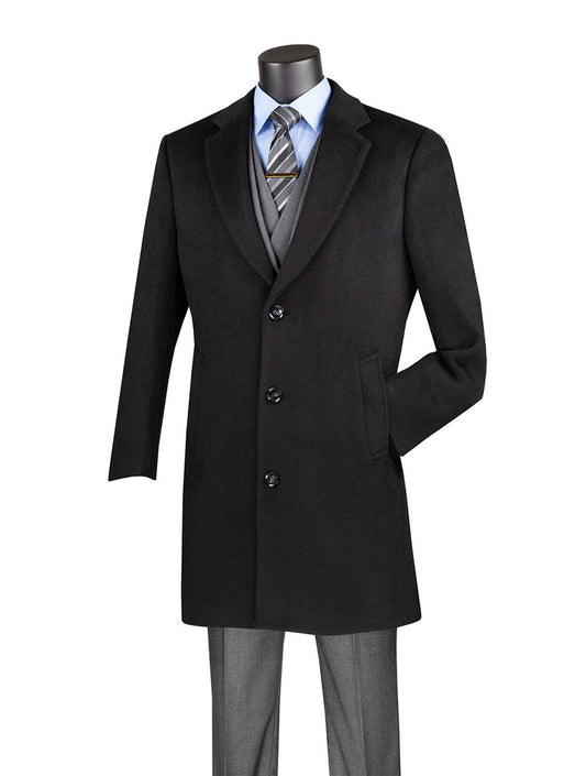 Mannequin dressed in a Vinci Wool & Cashmere Regular Fit Top Coat 38" Long in Black by Vinci Suits, paired with a gray suit, striped tie, and light blue dress shirt.