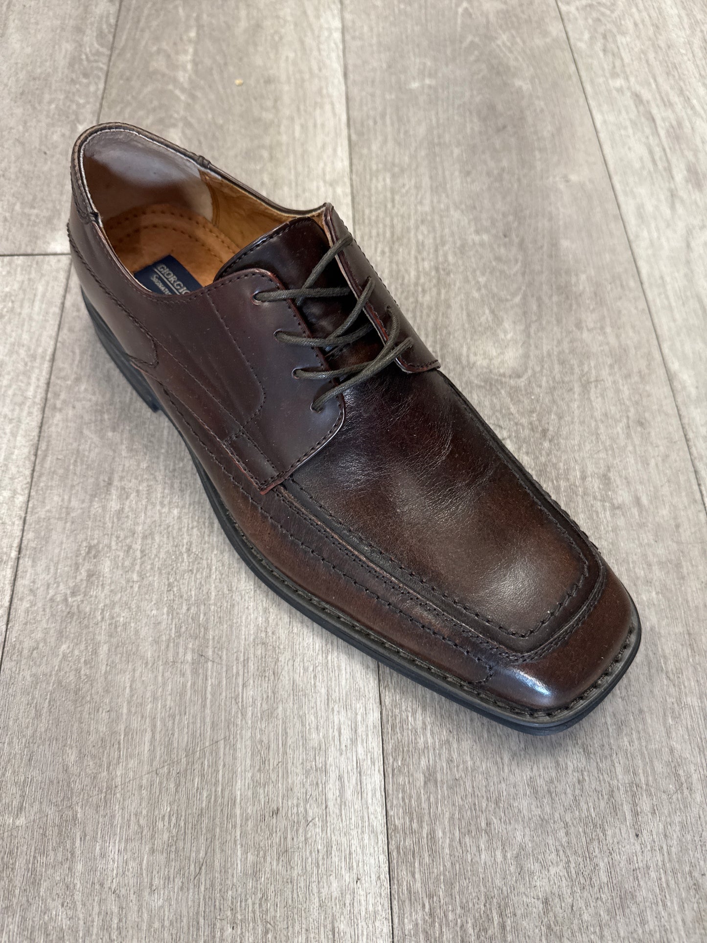 Product Details: Fiesso's Shoe 85 in dark brown leather (Size 9 only), a lace-up style dress shoe with a square toe, elegantly placed on a wooden floor. Please note: Final sale – no return, no exchange.