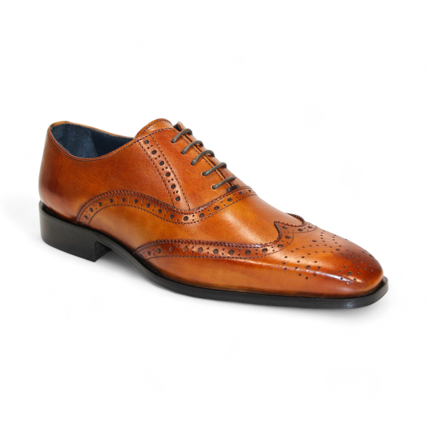 The Firmani Donald Cognac Shoe, crafted in Italy, is a single brown leather brogue shoe featuring decorative perforations and a lace-up closure, elegantly paired with a durable rubber sole.