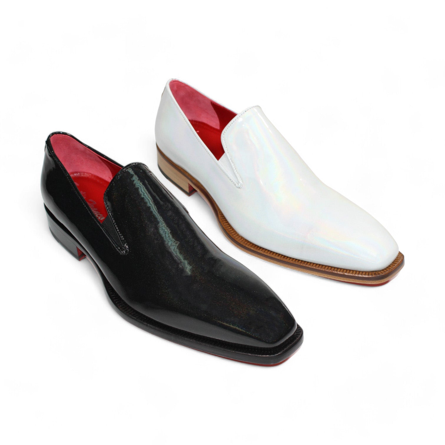 A pair of Emilio Franco Couture "EF13" shoes, featuring shiny patent croco slip-on design in black and white, with striking red leather interiors and wooden soles, showcased against a white background. Crafted with Italian precision by Emilio Franco Couture, these shoes exude elegance and style.