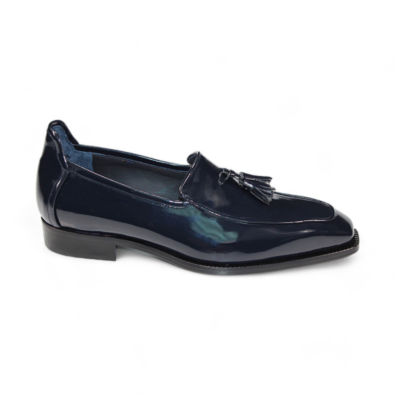 A single Duca Di Matiste Fano loafer in navy, expertly crafted with a tassel detail, displayed from the side against a white background. Made in Italy by Duca Di Matiste, it showcases exceptional craftsmanship and premium materials.