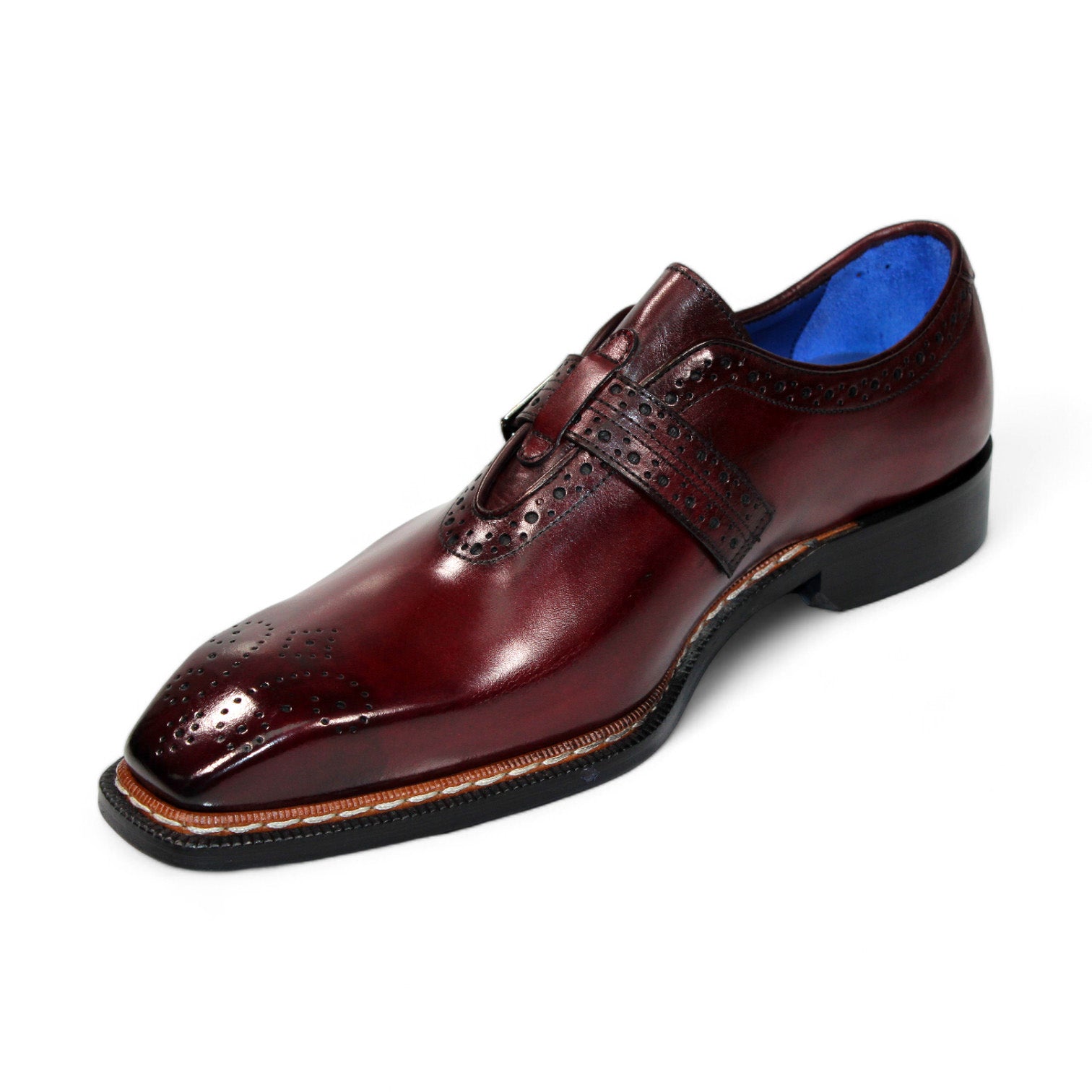 The Emilio Franco "Filippo" Burgundy Shoe, crafted from genuine Italian leather, showcases a brogue design and a buckle strap against a plain white background.