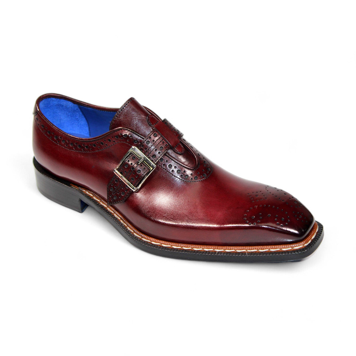 The Emilio Franco "Filippo" Burgundy Shoe, crafted from genuine Italian leather, showcases a brogue design and a buckle strap against a plain white background.