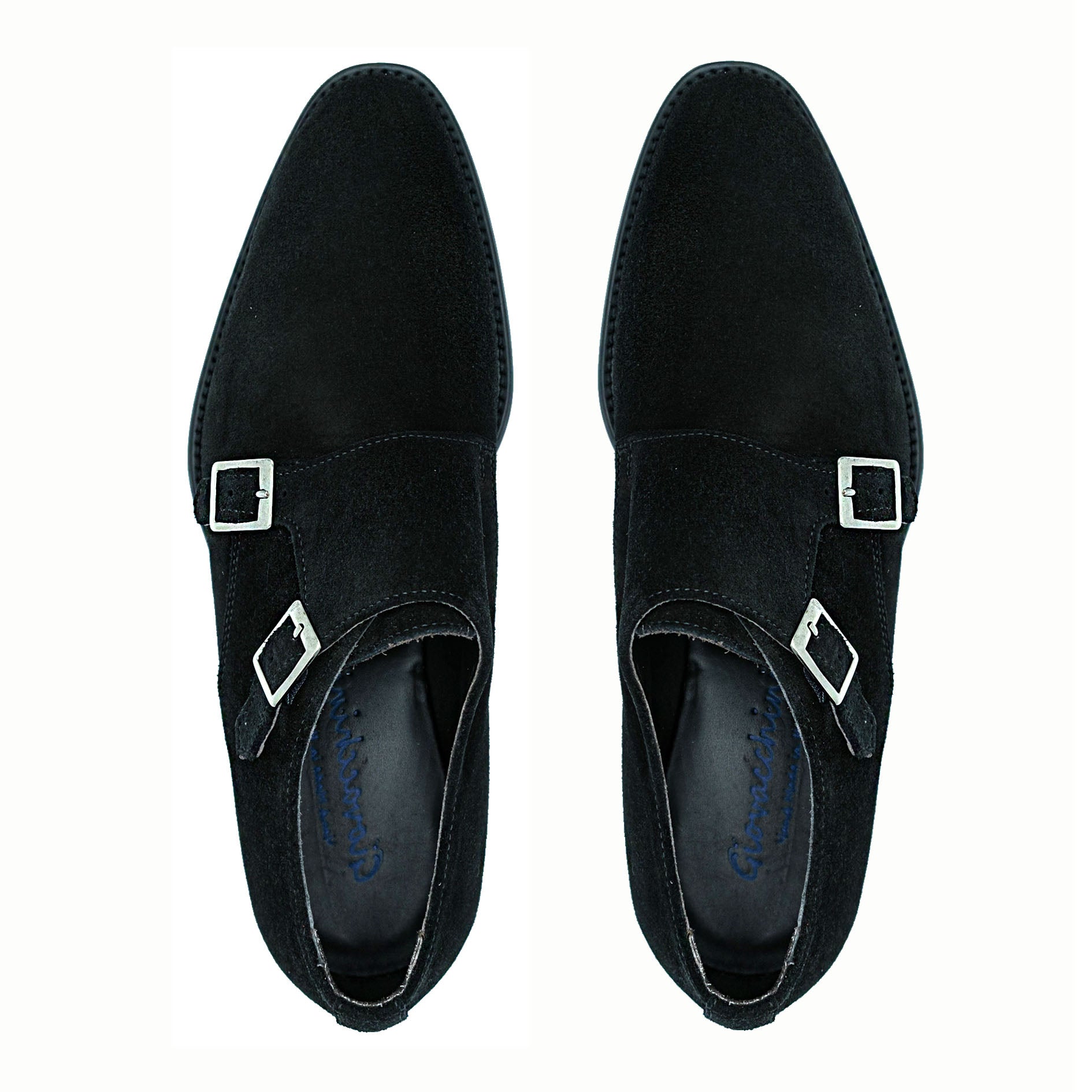 The GIOVACCHINI Francesco Black Suede Shoes, crafted in Italy by GIOVACCHINI, showcase two gleaming silver buckles and exude timeless elegance from the side view.