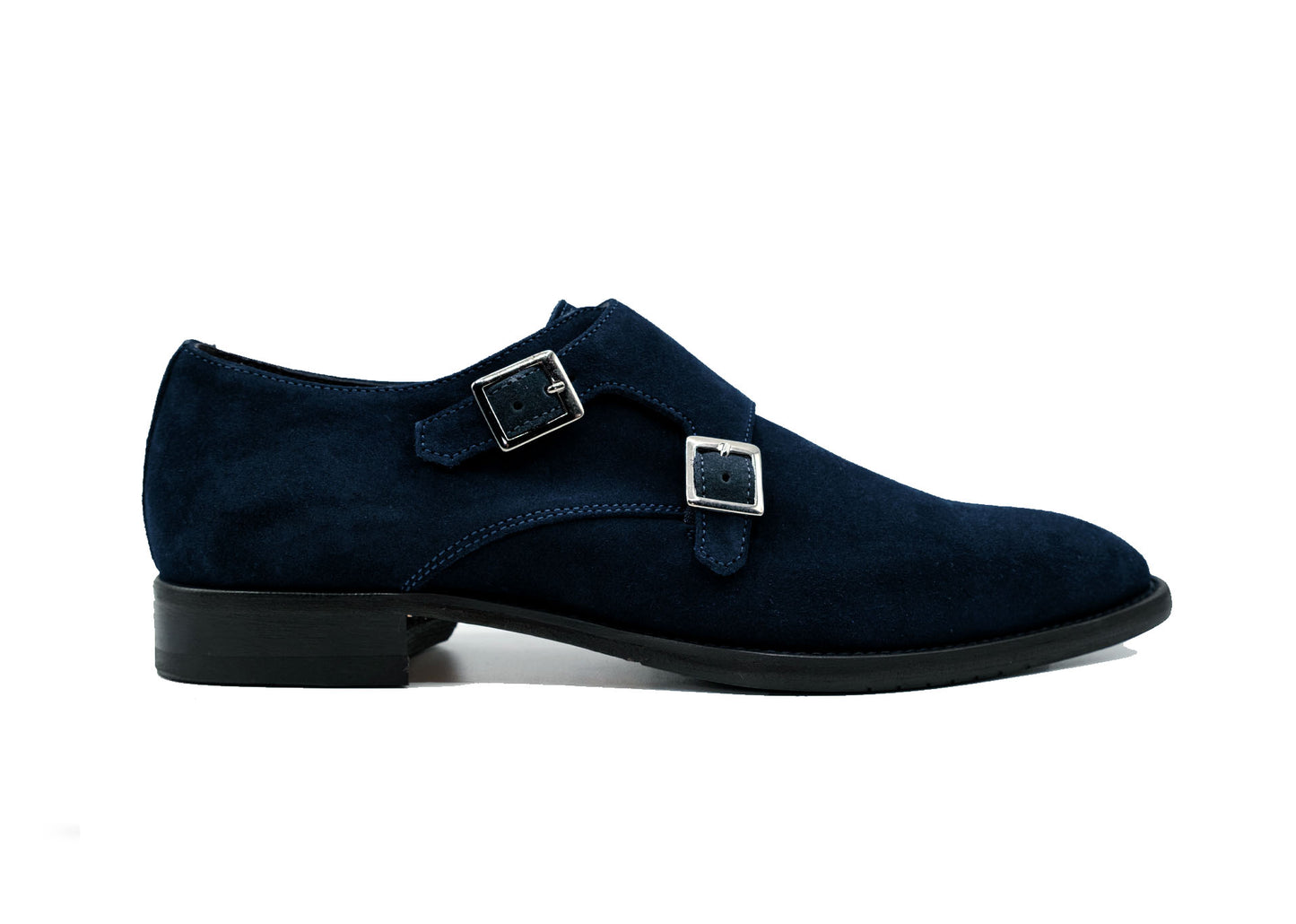 The GIOVACCHINI Francesco Blue Suede Shoes, expertly crafted from dark blue suede in Italy, showcase a sophisticated design with a black sole and lustrous silver buckles. Captured side-on against a pristine white background, they exude elegance and style.