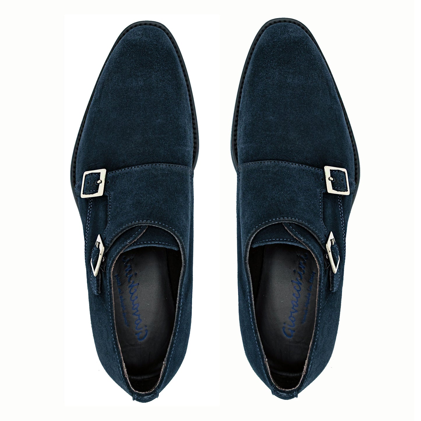 The GIOVACCHINI Francesco Blue Suede Shoes, expertly crafted from dark blue suede in Italy, showcase a sophisticated design with a black sole and lustrous silver buckles. Captured side-on against a pristine white background, they exude elegance and style.