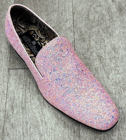 The Exclusive Formal Dress Shoe Pink BARNES by UNIQUE DESIGN MENSWEAR, featuring a pink glittery loafer crafted in genuine leather with a patterned interior, rests elegantly on a gray wooden floor.