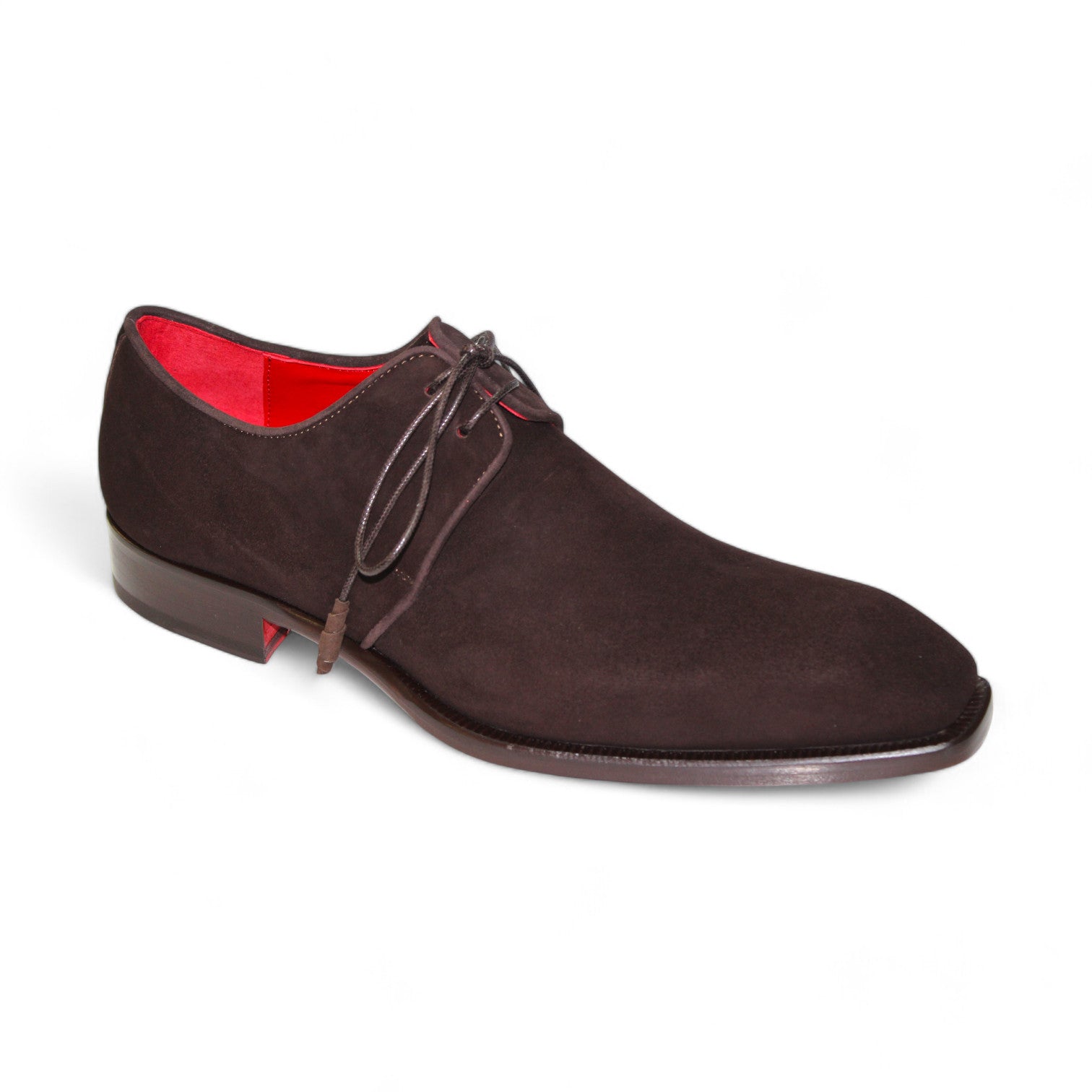 Emilio Franco's "Gabriele" chocolate shoe is a single brown suede dress shoe meticulously crafted in Italy, featuring a striking red interior lining and black laces. The shoe is elegantly showcased from the side and slightly angled for a sophisticated presentation.