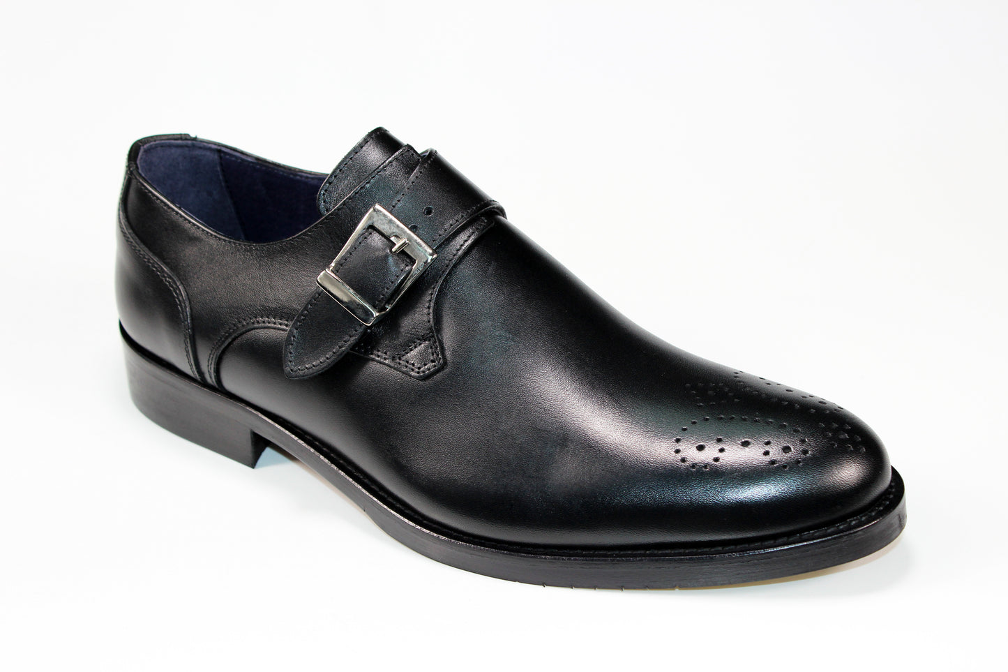 The Firmani Henry Black Shoes, crafted in Italy by Firmani, boast a stylish buckle strap and decorative perforations on the toe on its black leather design.