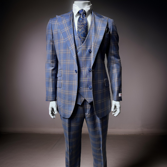 In a well-lit room, a mannequin displays the Tiglio Rosso Orvietto suit, fashioned from 100% wool. This elegant three-piece suit features a striking blue plaid design, paired perfectly with a patterned tie and pocket square. Available in sizes 54R and 50L only.