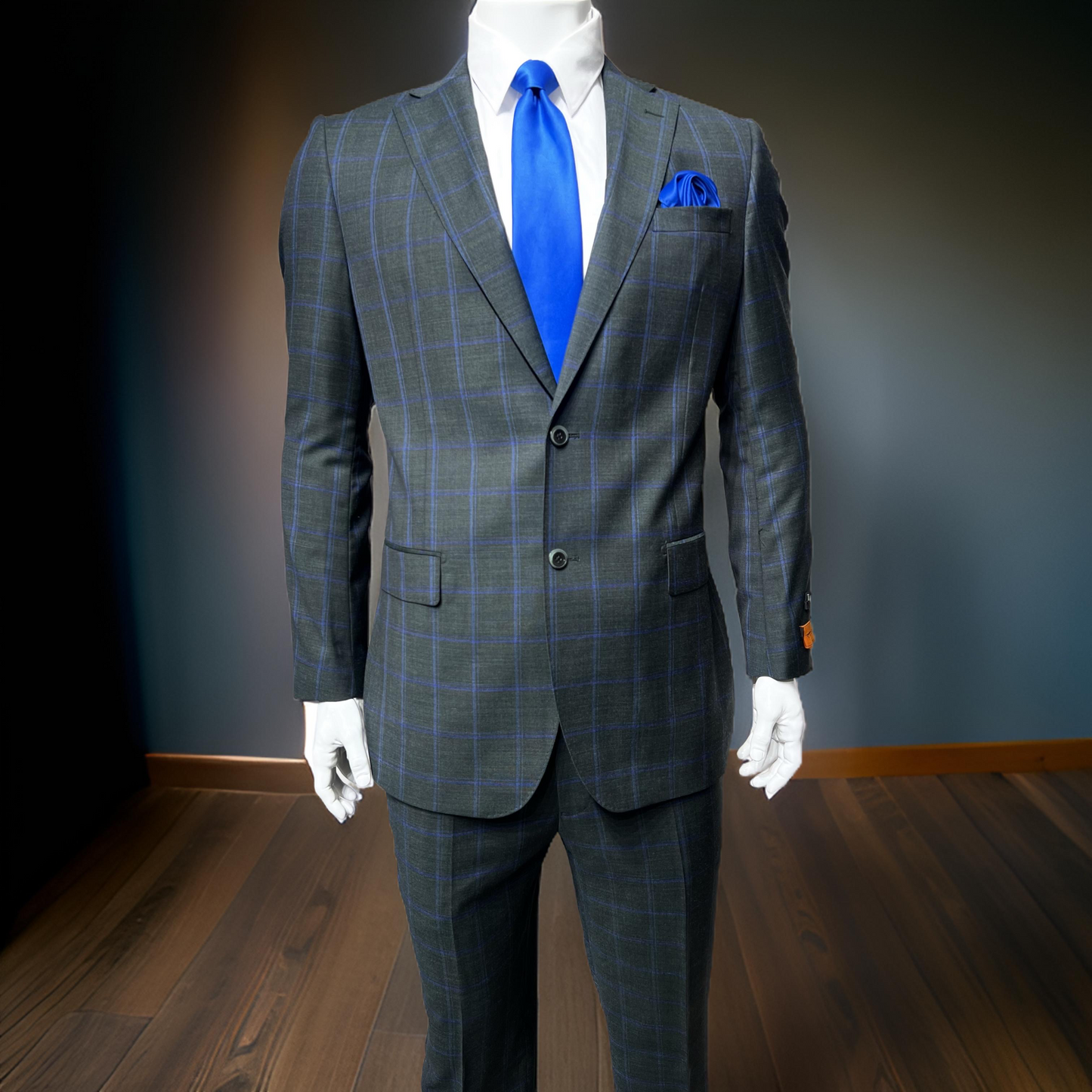 A mannequin elegantly displays men's clothing, showcasing the Tiglio Luxe Dolcetto Modern Fit Suit TL3112, crafted from pure wool and fine Italian fabrics.