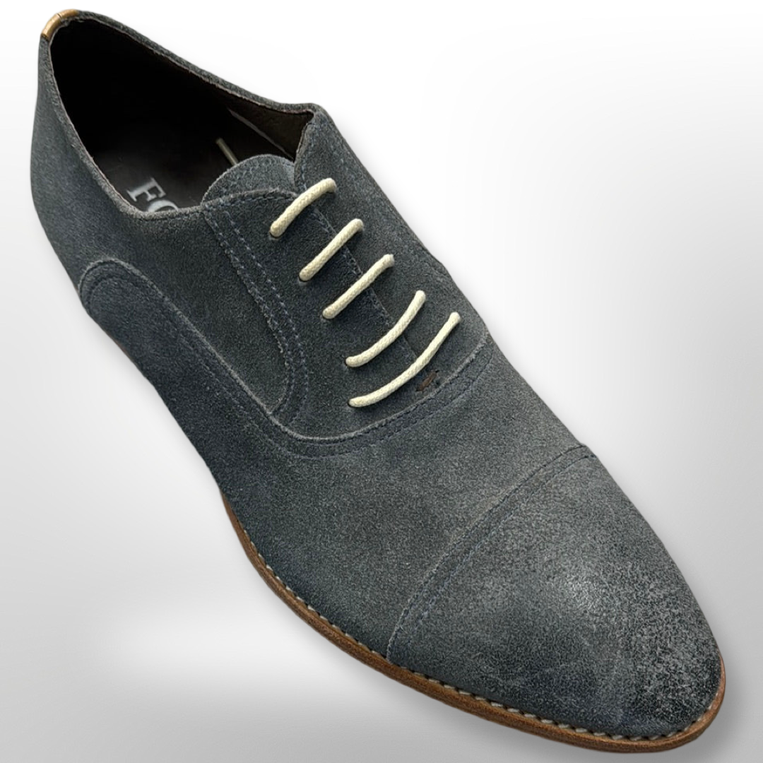 Shoe 27 by Fiesso in grey suede, featuring white laces and a brown sole, displayed from a side angle on a gray background. Please note: this item is final sale with no exchanges or returns available; only size 8 is available.