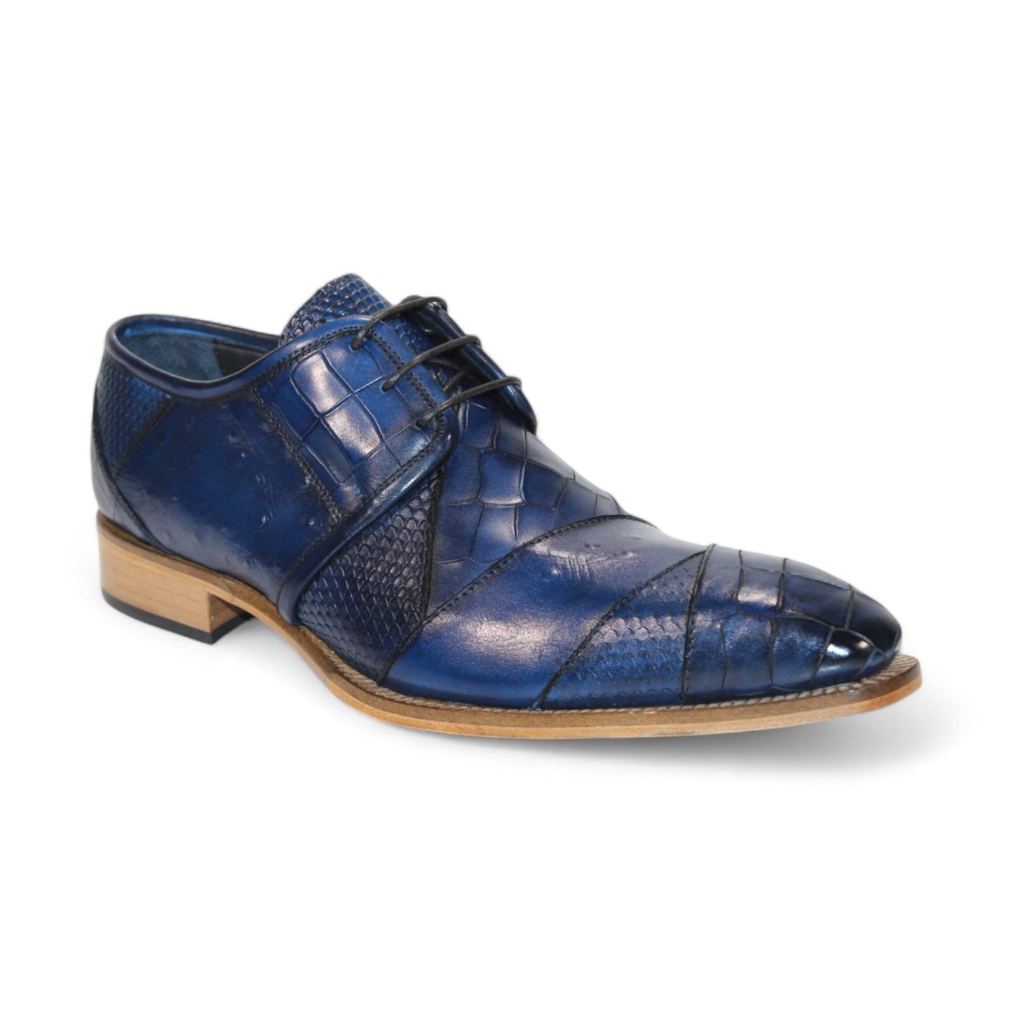 The Duca Di Matiste Imperio in Ocean Blue showcases a sophisticated leather dress shoe with an embossed crocodile pattern, complemented by a brown sole and black laces, viewed from the side. Crafted in Italy to add a touch of elegance.