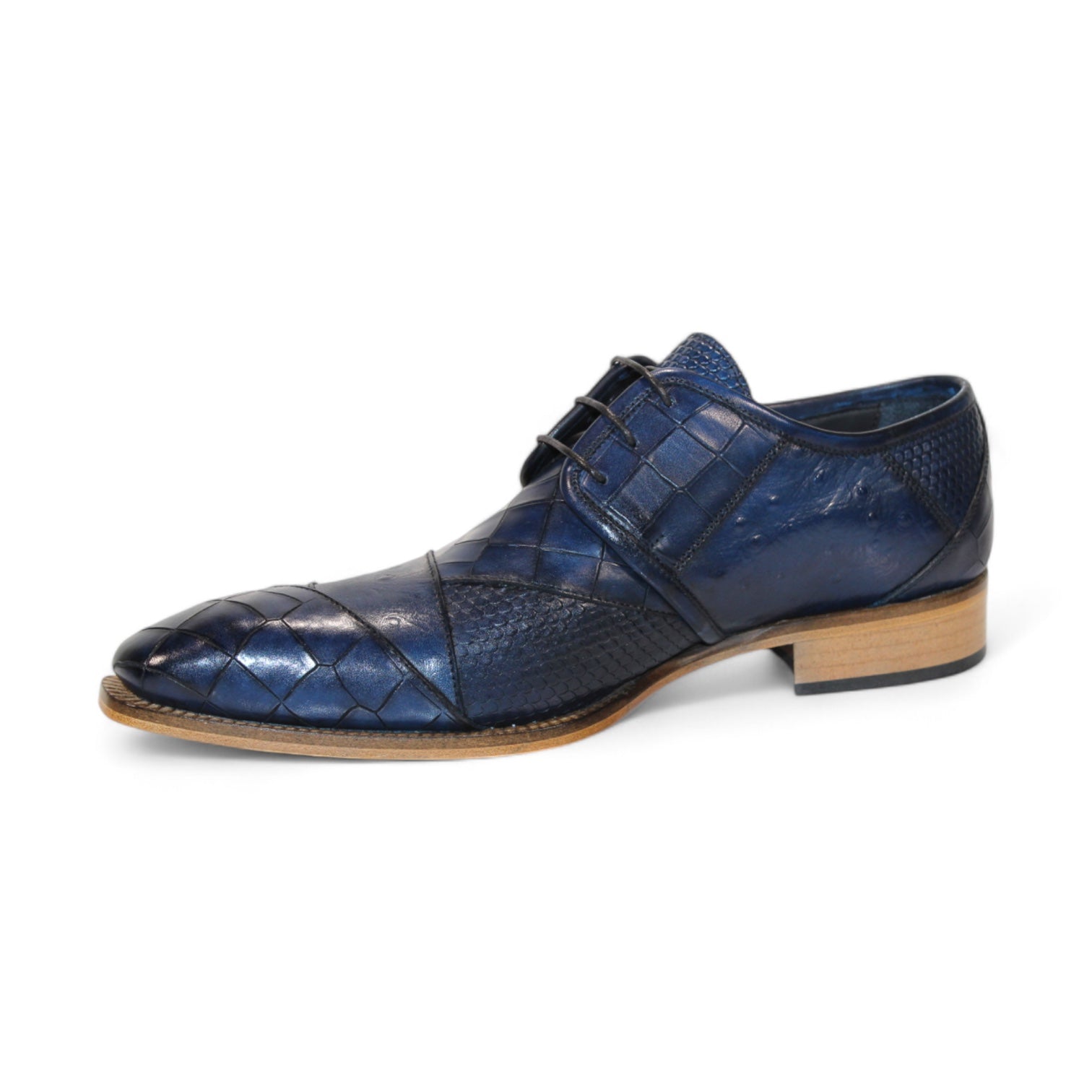 The Duca Di Matiste Imperio in Ocean Blue showcases a sophisticated leather dress shoe with an embossed crocodile pattern, complemented by a brown sole and black laces, viewed from the side. Crafted in Italy to add a touch of elegance.