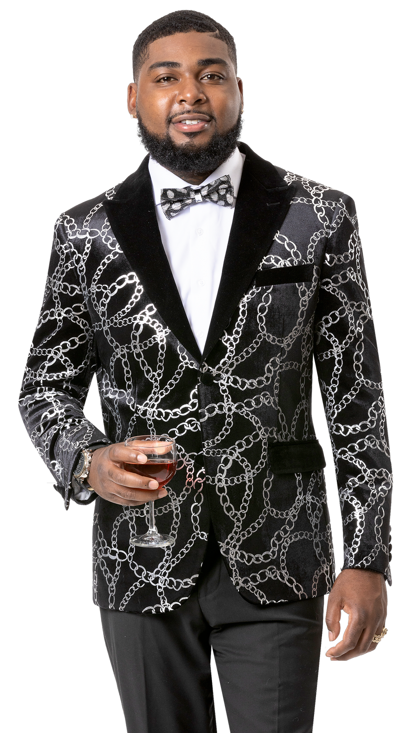 A man in an elegant EJ SAMUEL Black Blazer J123, characterized by a sophisticated silver chain-patterned finish, holds a glass of red wine.