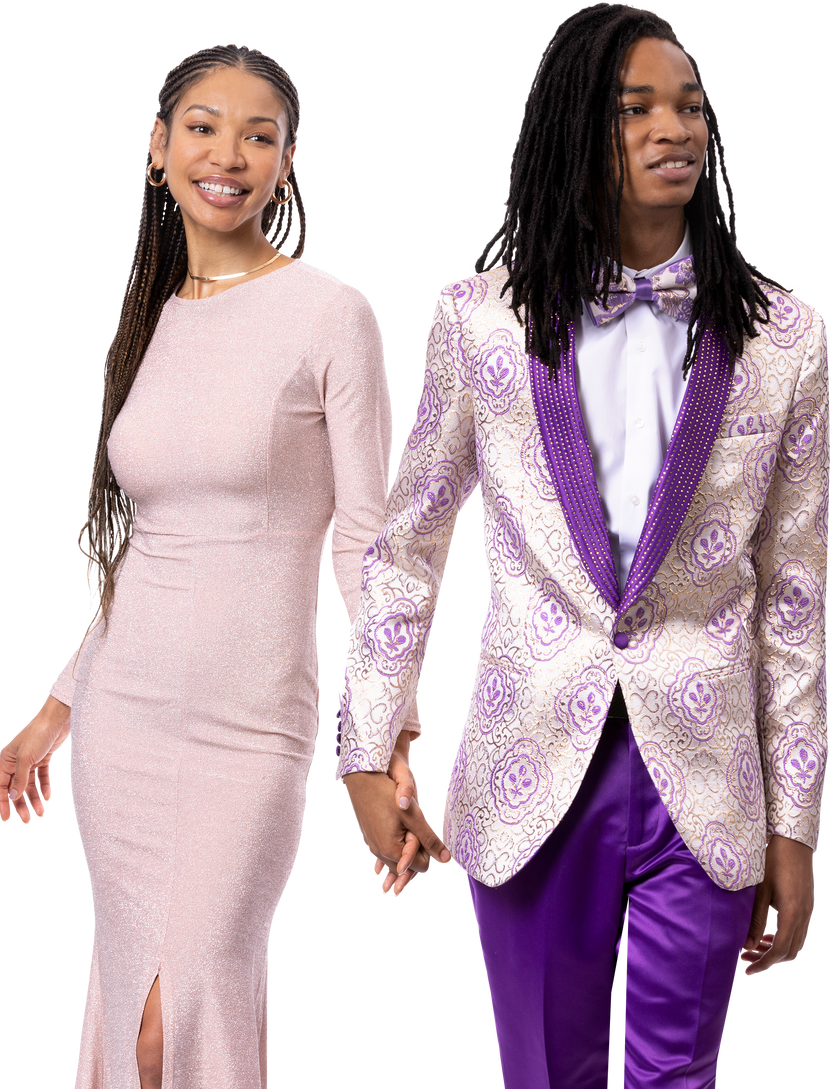 A couple holding hands, dressed formally. The woman is in a long pink dress, while the man is wearing the EJ Samuel Purple Suit JP135 by EJ SAMUEL, complete with a matching patterned jacket and pants along with a bow tie.