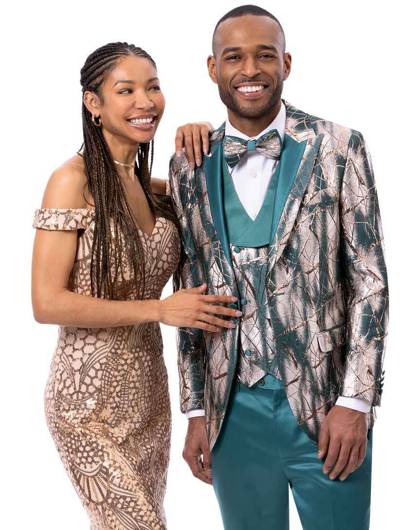 A smiling couple in formal attire: the woman stuns in a patterned off-shoulder dress while the man showcases the EJ Samuel Aqua Suit JP136 by EJ SAMUEL, complemented by a matching bowtie.