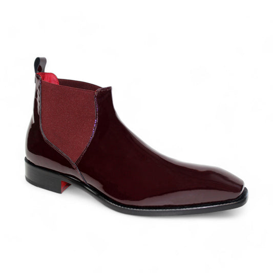 The Emilio Franco "Leonardo" Boot, a glossy burgundy Chelsea boot made from Italian patent leather with a square toe and an elastic side panel on a sleek black sole, is displayed against a white background.