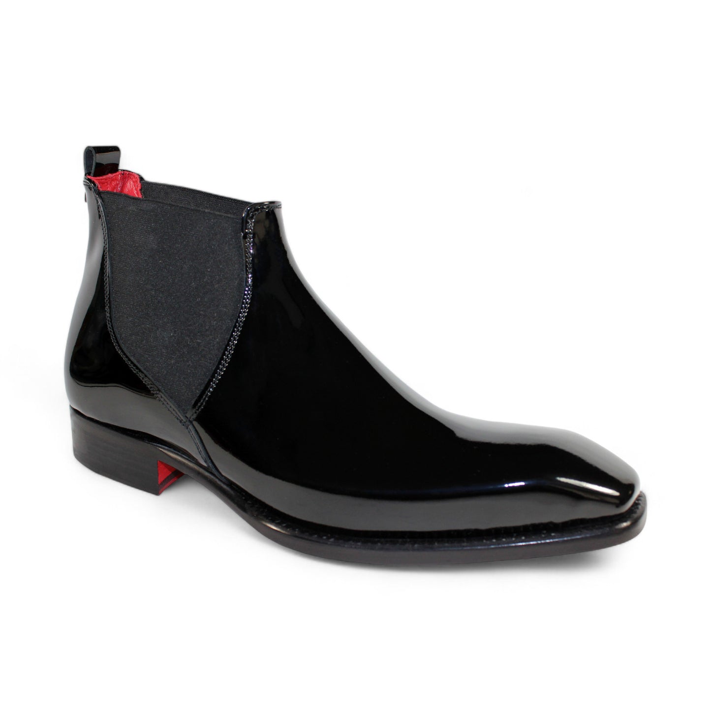 The Emilio Franco "Leonardo" black boot is a sleek Chelsea design made from exquisite patent leather, boasting a bold red interior and a low heel.