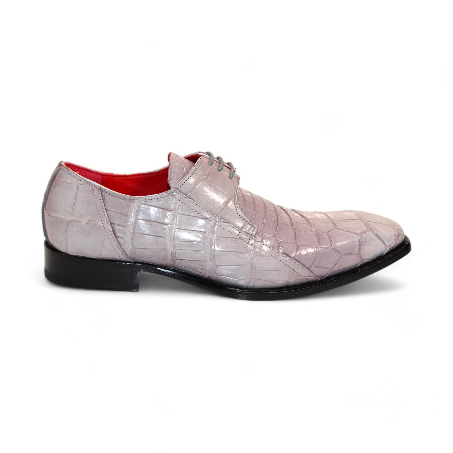 The Fennix "Logan" Grey Shoes by Fennix of Italy are a luxurious single dress shoe meticulously crafted, showcasing genuine alligator leather in a light purple hue with a crocodile pattern. They feature a pointed toe, black sole, red interior lining, and lace-up closure for the ultimate statement piece.