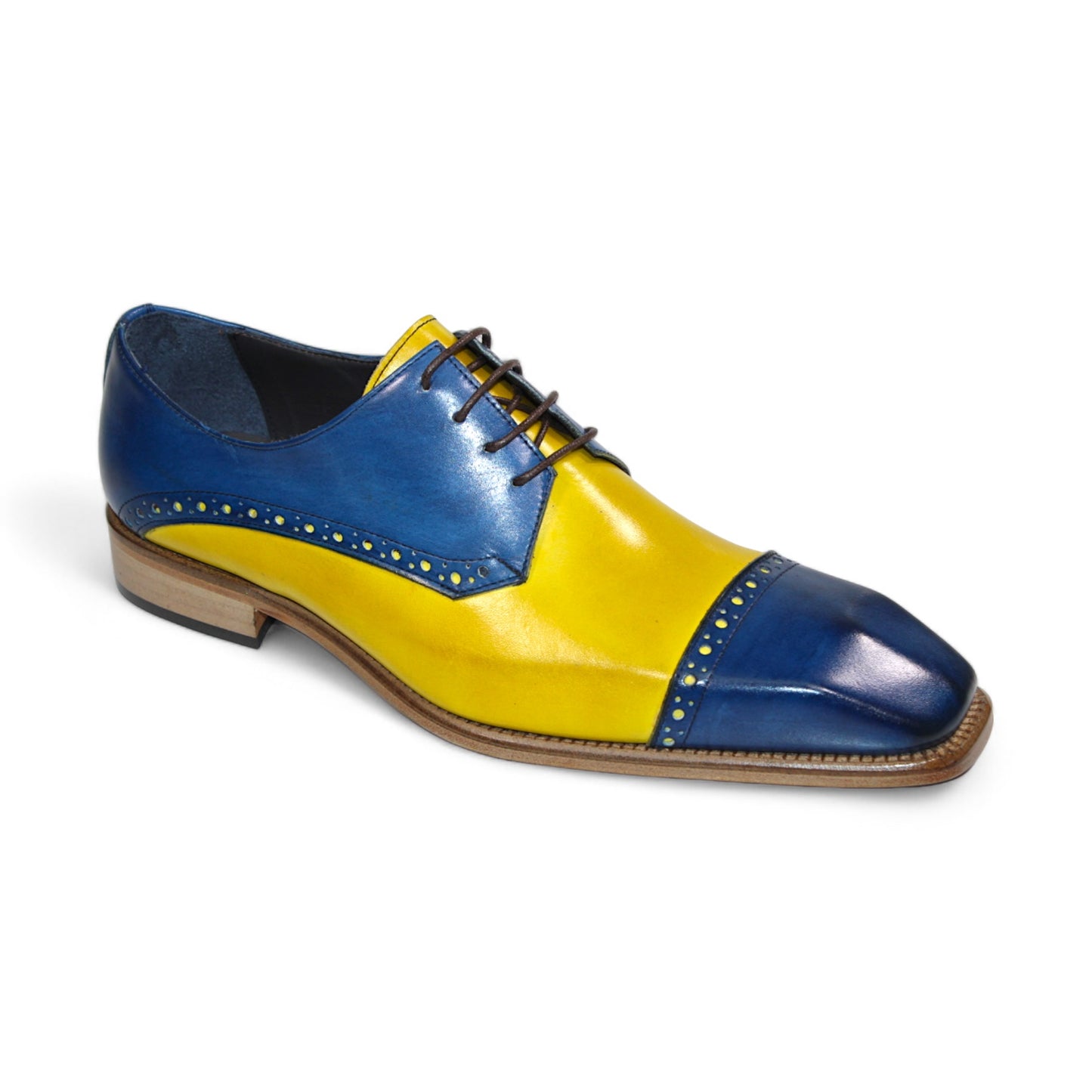 The Duca Di Matiste Lombardi dress shoe, featuring vibrant ocean blue and yellow leather with decorative perforations and brown laces, is expertly crafted in Italy.