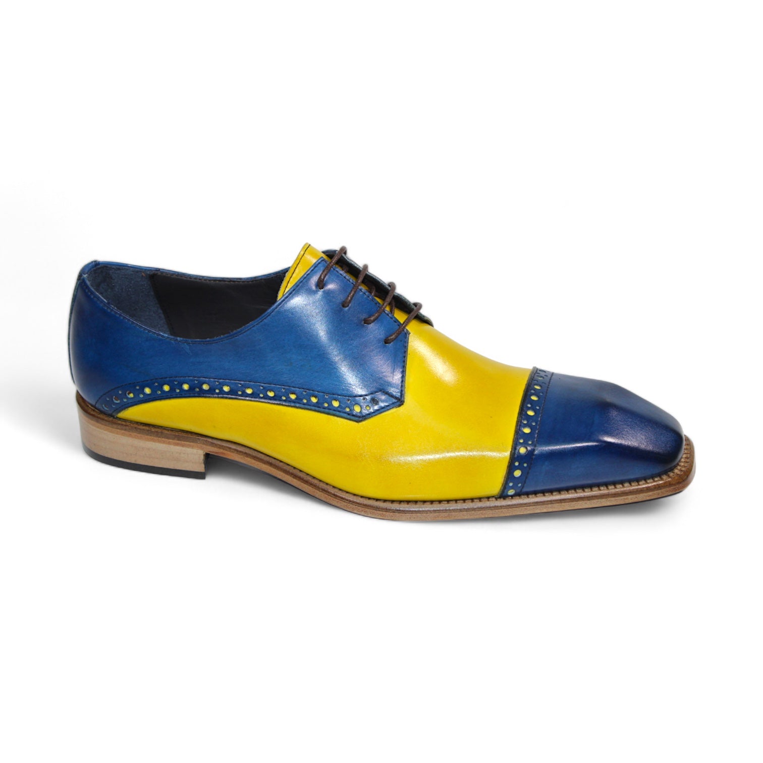 The Duca Di Matiste Lombardi dress shoe, featuring vibrant ocean blue and yellow leather with decorative perforations and brown laces, is expertly crafted in Italy.