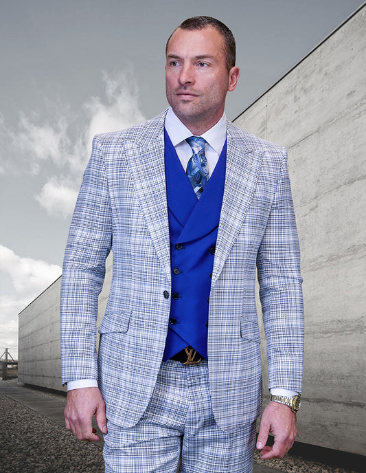 A man wearing a STATEMENT CLOTHING | LOUIS-ROYAL suit, designed in a sleek, modern-fit with Italian wool, stands outside against a concrete building and cloudy sky.