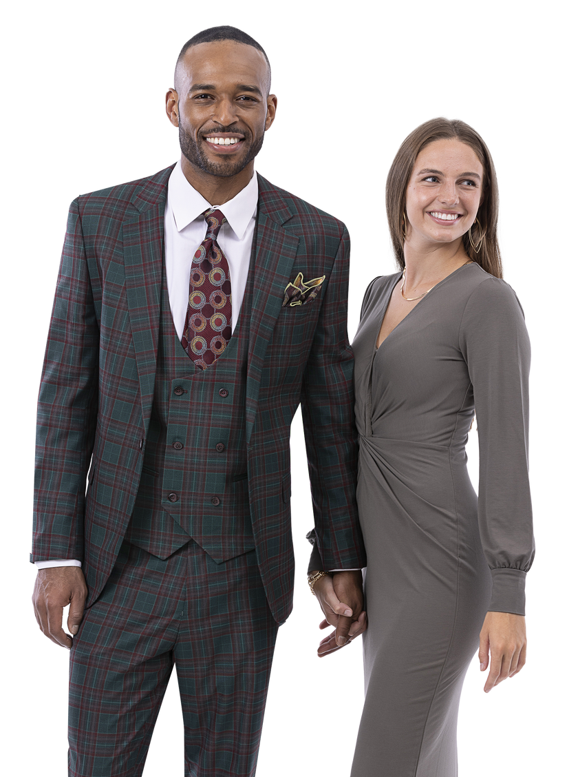 A man wearing the EJ Samuel Green Suit M2798 in a modern fit, featuring a matching vest, stands holding hands with a woman in a gray dress, both smiling.