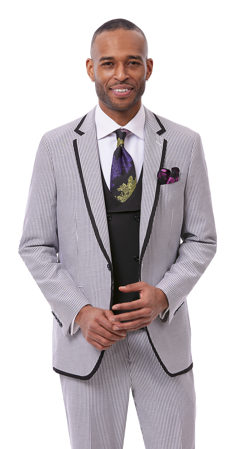 A man in a EJ Samuel Black Suit M2809, enhanced with a purple tie and pocket square, along with a matching solid vest, stands and smiles at the camera.