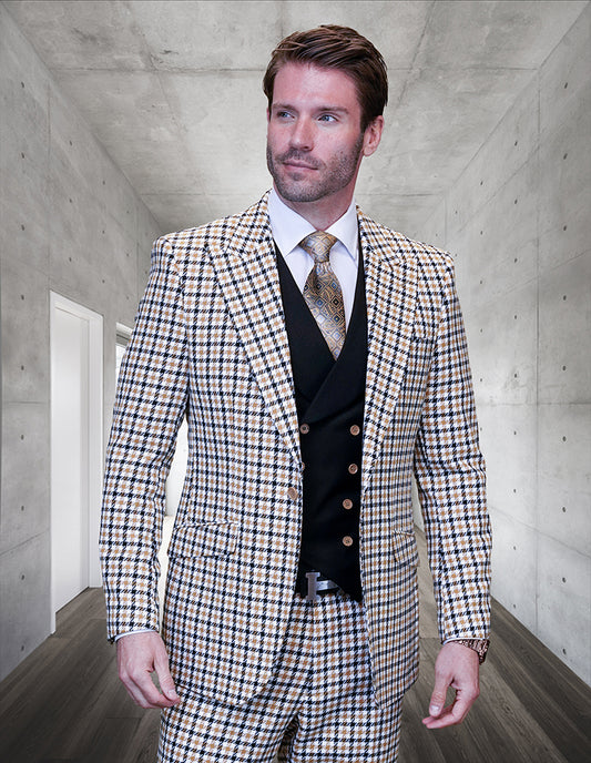 A man wearing the STATEMENT CLOTHING | MASIMO-CAMEL, a modern fit plaid suit complete with a vest and tie from Statement Clothing, stands in a concrete hallway.