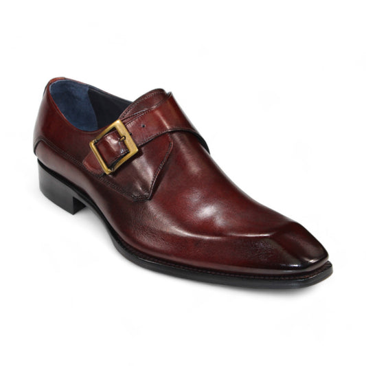 The Duca Di Matiste Massa (Brown) by Duca Di Matiste is depicted against a plain white background, showcasing its Italian leather craftsmanship with a brass buckle strap, square toe, and low heel.