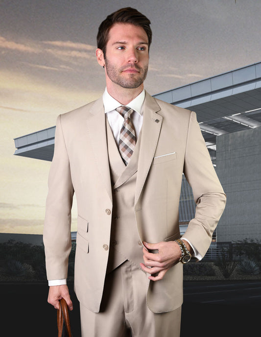 A man wearing the MESSINA-TAN suit from Statement Clothing, crafted from elegant Italian wool, stands confidently in front of a modern building.