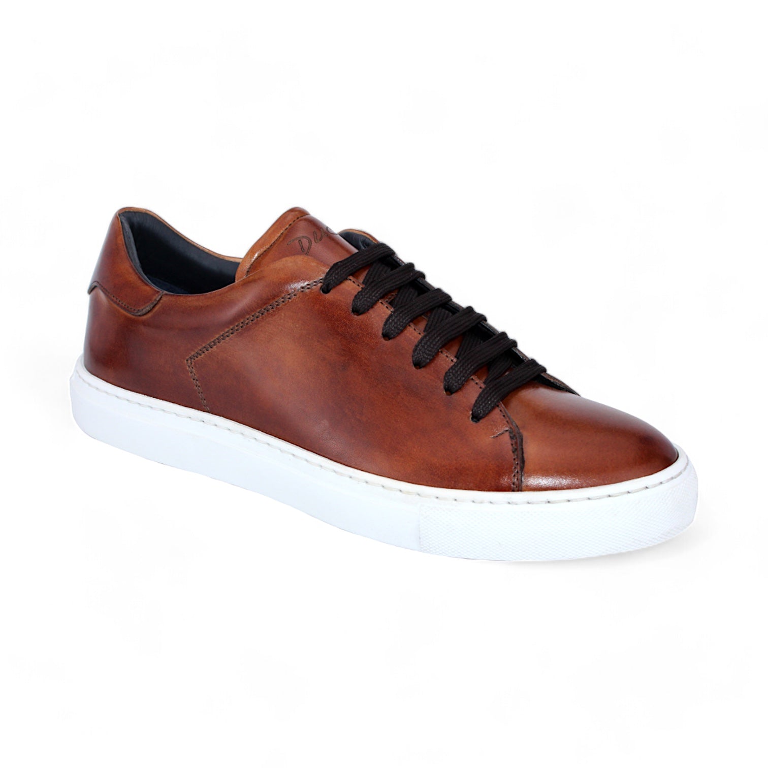 The Duca Di Matiste Monza (Brandy) sneaker features brown leather with black laces and a white rubber sole, crafted from premium materials, showcased in a side view against a plain white background.