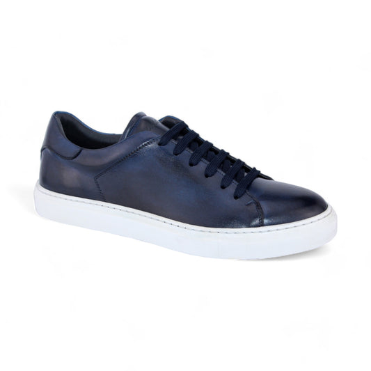 The Duca Di Matiste Monza (Navy) sneaker, expertly crafted in Italy, features a navy blue leather upper with white soles and navy laces, set against a white background.