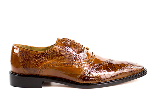 The Belvedere - Nino, Genuine Ostrich Leg and Eel Dress Shoe in Antique Camel from BELVEDERE, showcases a side view of its exquisite design. It features decorative stitching and laces, with a shiny finish and low heel. The plush cushion insole ensures all-day comfort while the luxurious leather lining adds an extra touch of sophistication to this elegant shoe.