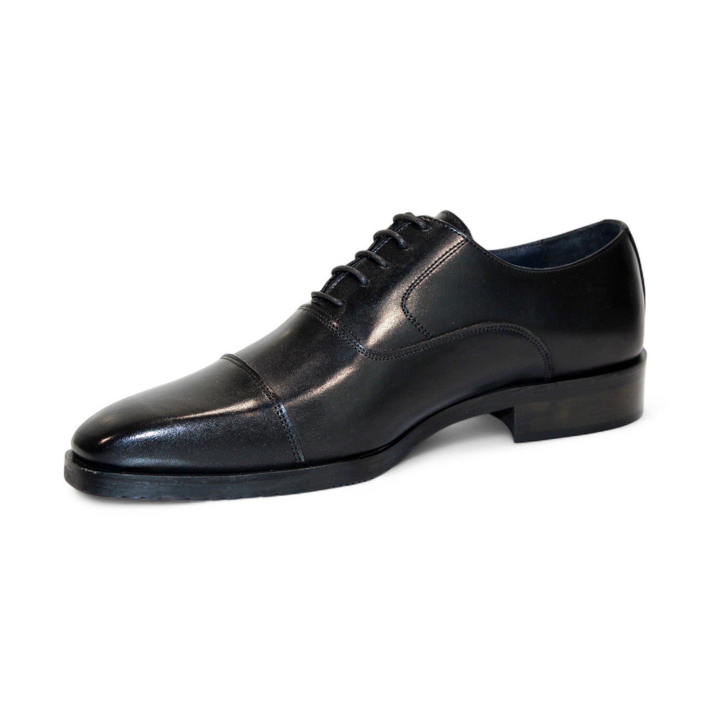 The Firmani Owen Black Shoes feature a solitary black leather dress shoe with laces, highlighting a cap toe design and low heel, as seen from the side. Masterfully crafted in Italy by Firmani, it represents timeless elegance and expert craftsmanship.