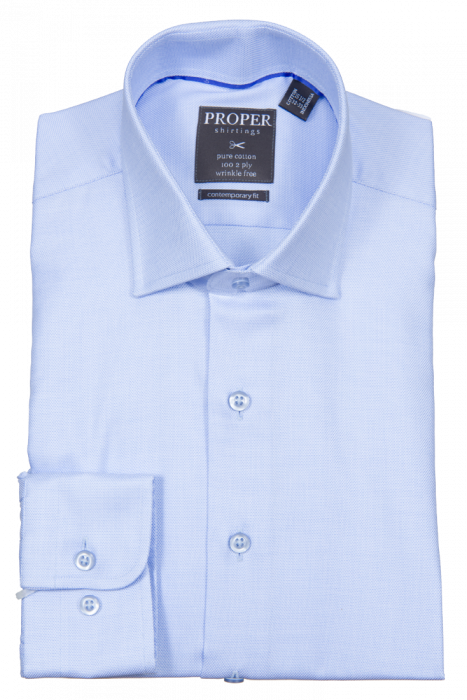 The PROPER SHIRTINGS BLUE CONTEMPORARY FIT REGULAR CUFF P205ET0R-BLU from Proper Shirtings is a neatly folded, long-sleeve dress shirt in light blue. Crafted from wrinkle-free cotton, it features buttoned cuffs for a contemporary fit and includes a branded tag with care and size information.