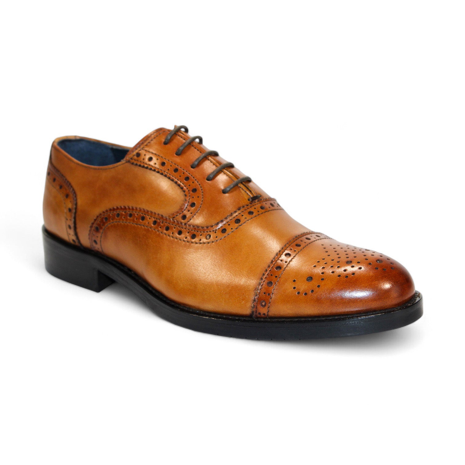 Displayed are three pairs of Firmani leather dress shoes, including the elegant Paul Cognac in tan, brown, and black hues, all featuring decorative perforations on the toe and sides that highlight their classic style.